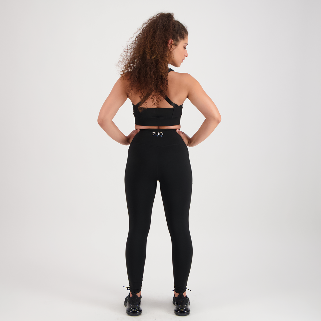 View from back. Full body model in full-length leggings in black